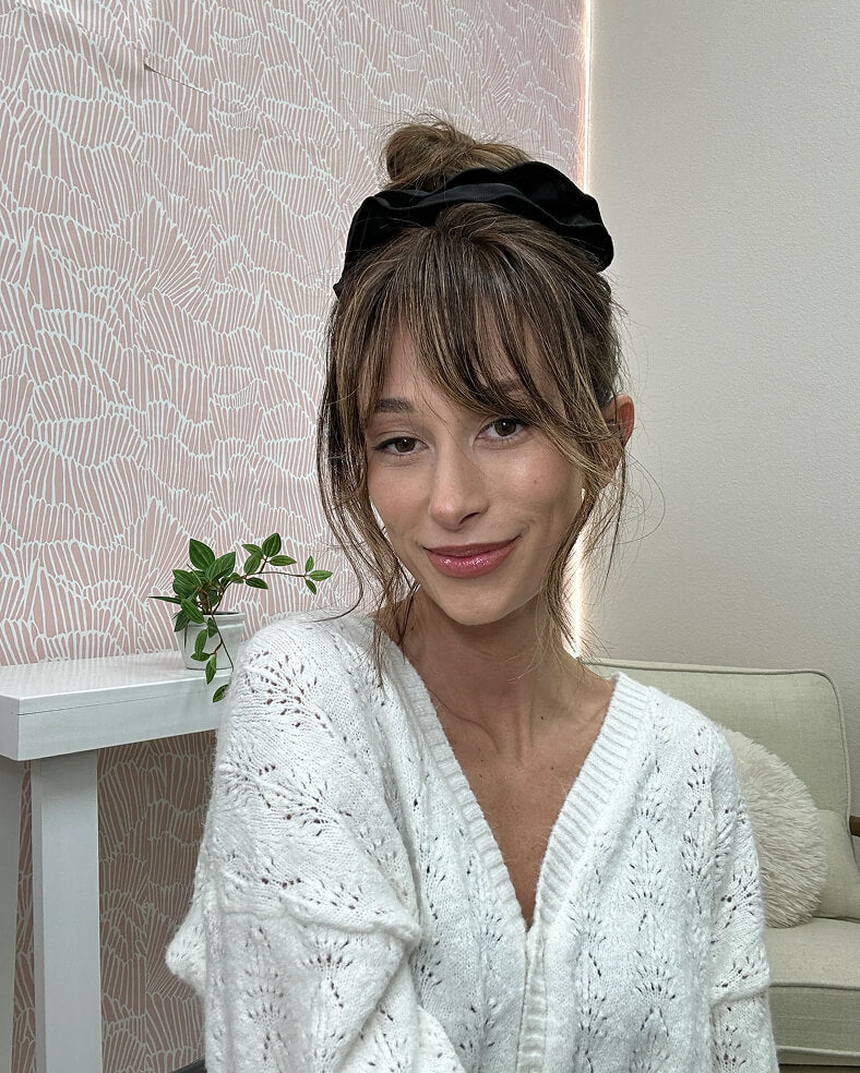 Woman wearing a Milano topper with her hair styled up